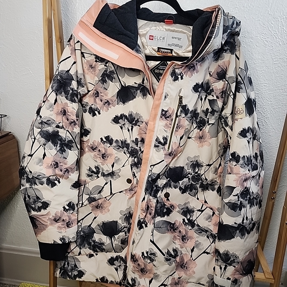 686 Brand Snowboarding Jacket with Pink and Black Floral Accents
